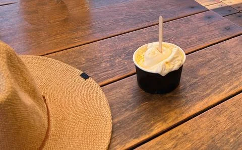 Vanilla bean Ice Cream on a table at the the seaside on a hot summers day Stock Photos