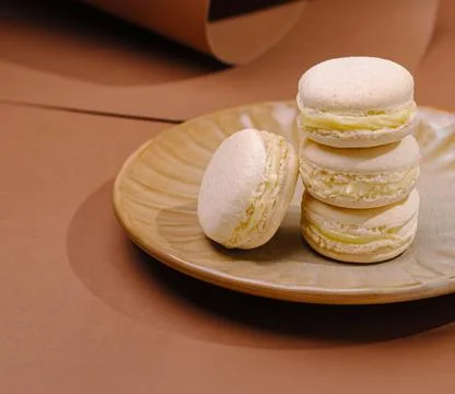Vanilla bean macarons stacking on ceramic plate 写真素材