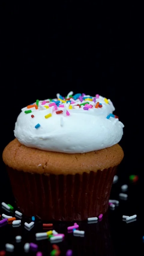 Vanilla Cupcake with Colorful Sprinkles Rotating on Turntable Stock Footage 330516757