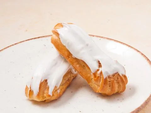 Vanilla Eclair cake on a plate. Close up Stock Photos