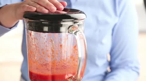 Vanilla ice cream being added to strawberry puree Video stock 24657783