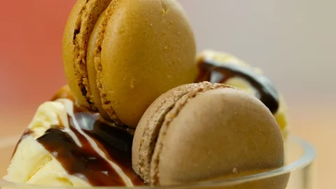 Vanilla ice cream macro closeup with chocolate sauce and macron cookies. Stock Footage 92284313