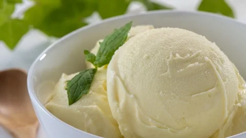 Vanilla Ice Cream Scoops With Mint Garnish, Close-Up Stock Footage 342017390