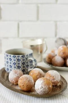 Vanilla krapfen doghnut with coffee. Rustic style. Stock Photos