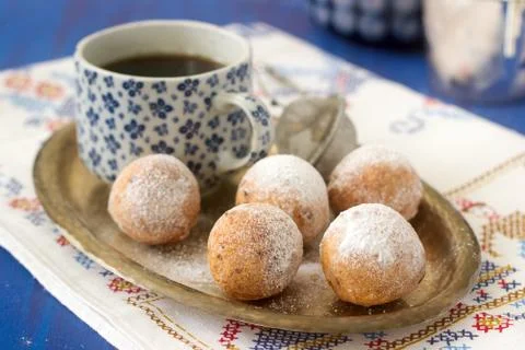 Vanilla krapfen doghnut with coffee. Rustic style. Stock Photos