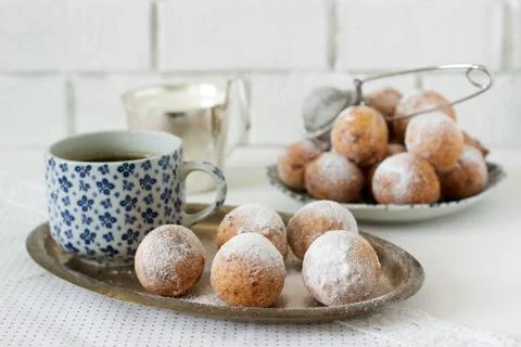 Vanilla krapfen doghnut with coffee. Rustic style. Stock Photos