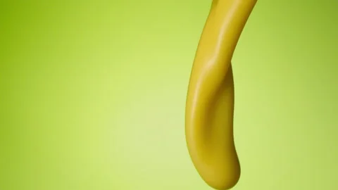 Vanilla milkshake pouring over flat background Stock Footage 149062779