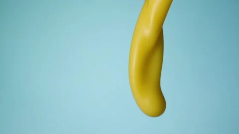 Vanilla milkshake pouring over flat background Stock Footage 149062787