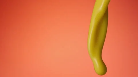 Vanilla milkshake pouring over flat background Stock Footage 149062894