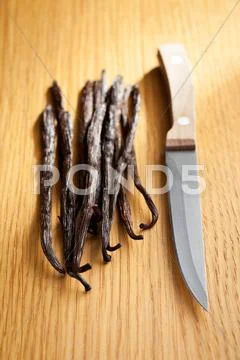 Vanilla pods with knife Stock Photos