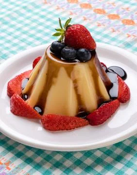 Vanilla pudding with chocolate syrup Stock Photos