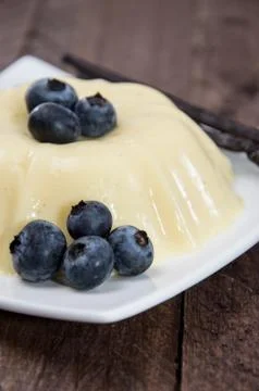 Vanilla pudding topped with berries Stock Photos