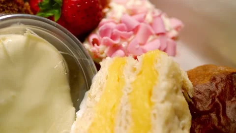 Vanilla slice with selection of cakes and sweets for afternoon tea Stock Footage 220432158