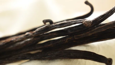 Vanilla sticks on white fabric Stock Footage 123965583