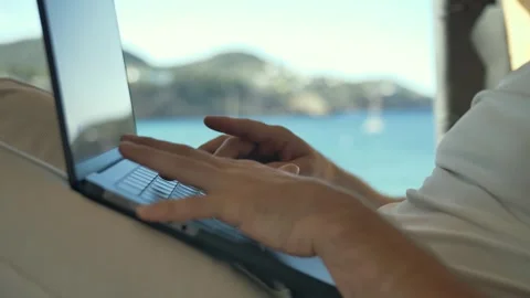 Vanlife work setup focusing on the laptop keyboard in scenic surroundings Vidéo 291896841