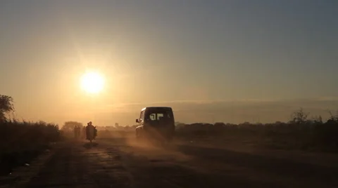 Vans Driving in the Sun in SOUTH SUDAN, AFRICA Stock Footage