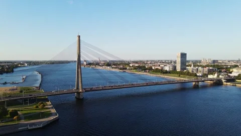 Vanšu Cable-Stayed Bridge Crosses River in Evening Light – Riga, Latvia Stock Footage 314559196