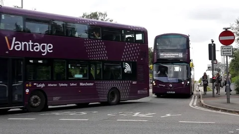 Vantage bus on Manchester to Leigh guided busway leaving the guided section Stock Footage 80206293