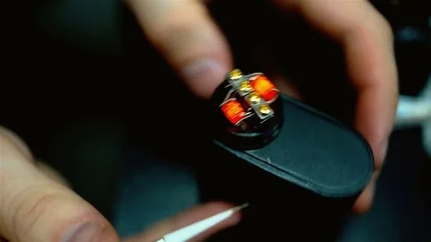 Vape after-sales service of the e-cigarette. Regulate coils. Stock Footage 74582724