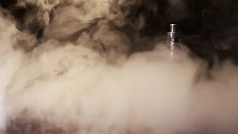Vape on a black table in clouds of smoke Stock Footage 244647883