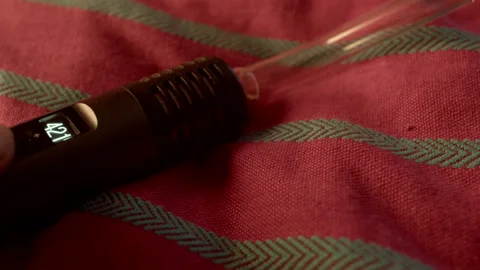 Vape device closeup. Lighting captures vape with distinctive display Vidéo 333906695