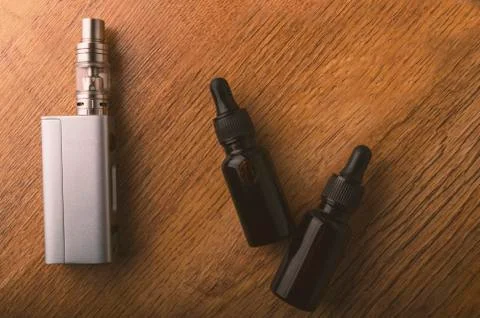 Vape device or electronic cigarette with vaping tools and accessories. Stock Photos