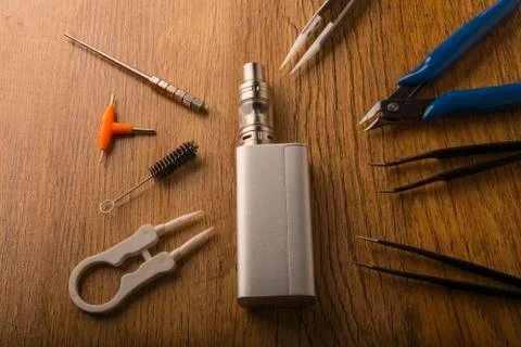 Vape device or electronic cigarette with vaping tools and accessories. Stock Photos