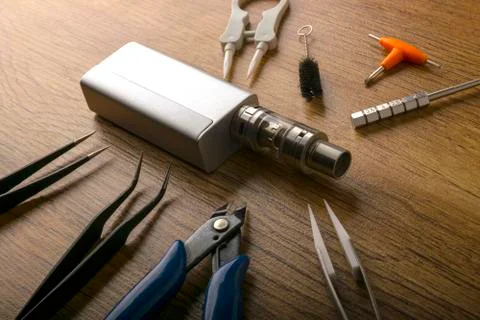 Vape device or electronic cigarette with vaping tools and access Stock Photos