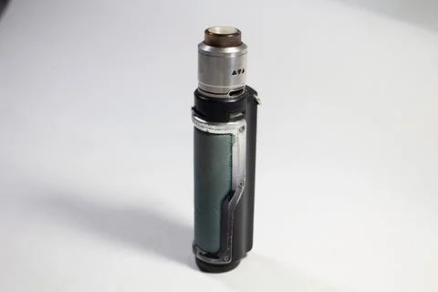 Vape e-cigarette on a white background. Close-up. Stock Photos