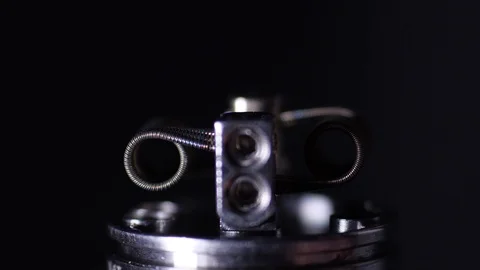 Vape macro Coil heating in atomizer for vaping or e-cigarette Video stock 102702939