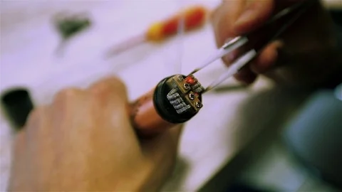 Vape. Male hands regulate electronic cigarette coils. Stock Footage 73178398