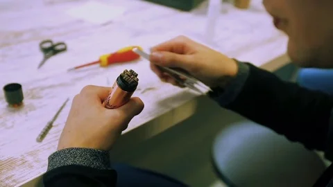 Vape. Male hands regulate electronic cigarette coils. Stock Footage 73178464