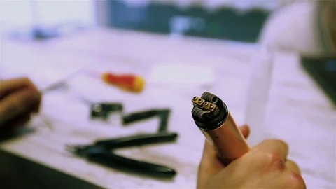 Vape. Male hands regulate electronic cigarette coils. Stock Footage 73178526
