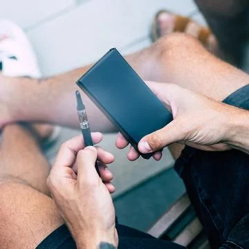 Vape Product Packaging in Hands Stock Photos