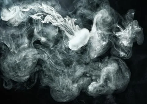 Vape ring like smoke ring on dark background Stock Photos