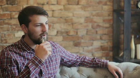 Vaper smoking electronic cigarette Stock Footage 65602976