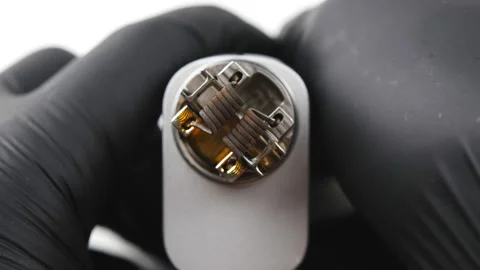 Vaping atomizer with clapton coil is working. Vape device or cigarette. Stock Footage 131852747