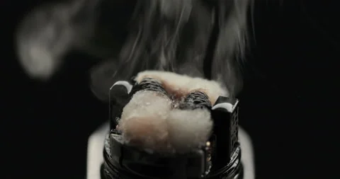 Vaping atomizer with cotton wool is working Stock Footage 144830772