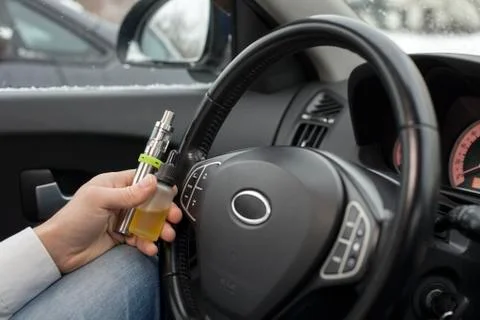 Vaping device and e-liquid. Stock Photos