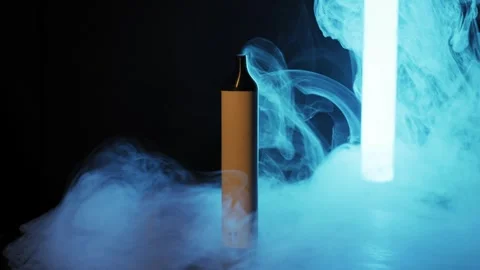Vaping Device Rotates in Colorful Smoke with Neon Light Stock Footage 325878545