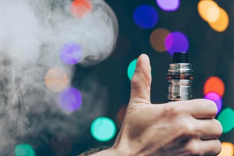 Vaping e-liquid from an electronic cigarette Stock Photos