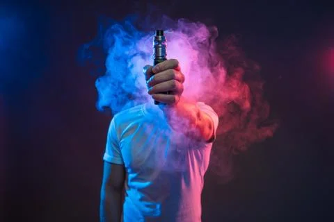 Vaping e-liquid from an electronic cigarette Stock Photos