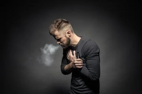 Vaping e-liquid from an electronic cigarette Stock Photos