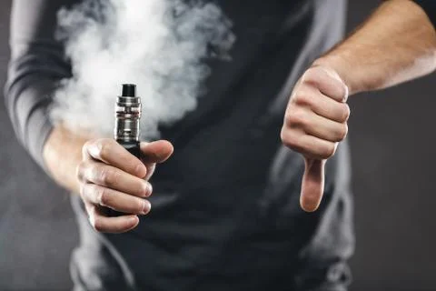 Vaping e-liquid from an electronic cigarette Stock Photos