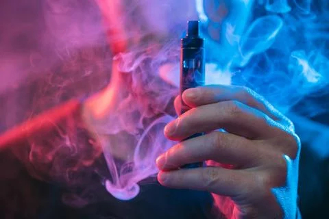 Vaping e-liquid from an electronic cigarette Stock Photos