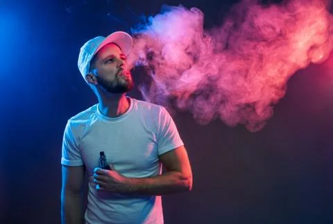 Vaping e-liquid from an electronic cigarette Stock Photos