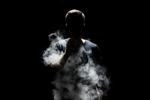 Vaping e-liquid from an electronic cigarette Stock Photos