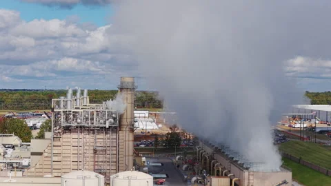Vapor clouds roll from TVA power plant as AI data center appears behind Stock Footage 328137255