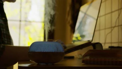 Vapor coming from blue led esential oil diffuser Stock Photos