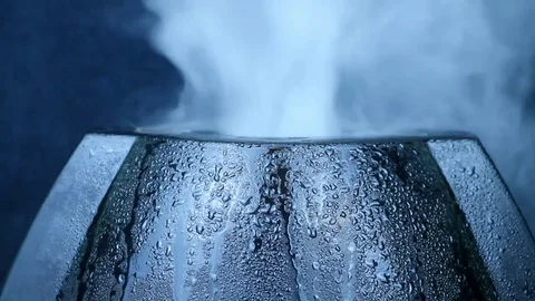 Vapor from humidifier. Macro of a drop of steam on a working air purifier. Video stock 85280480
